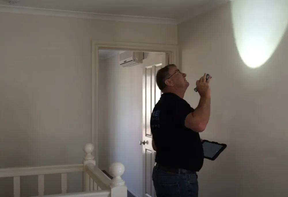 Building inspector reviewing construction stage work on a new Australian home
