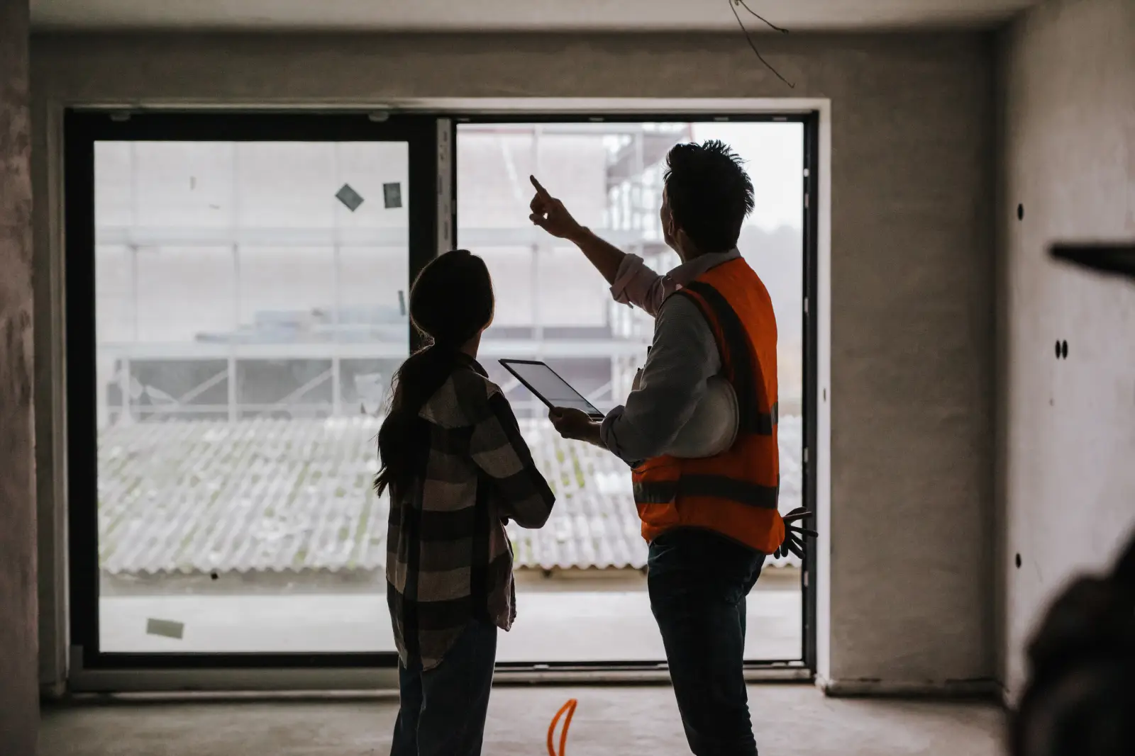 Building inspector documenting home defects with a camera during a property inspection