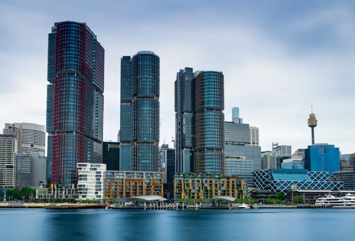 Licensed building inspector examining plumbing pipes for defects in an Australian home
