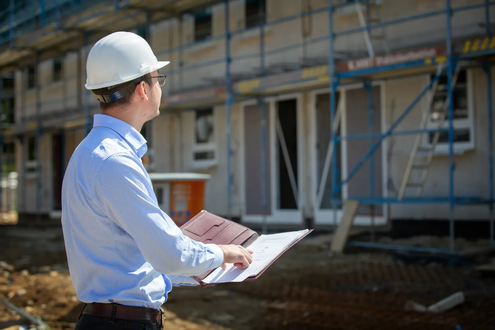 Building inspector examining foundation reinforcement on an Australian construction site